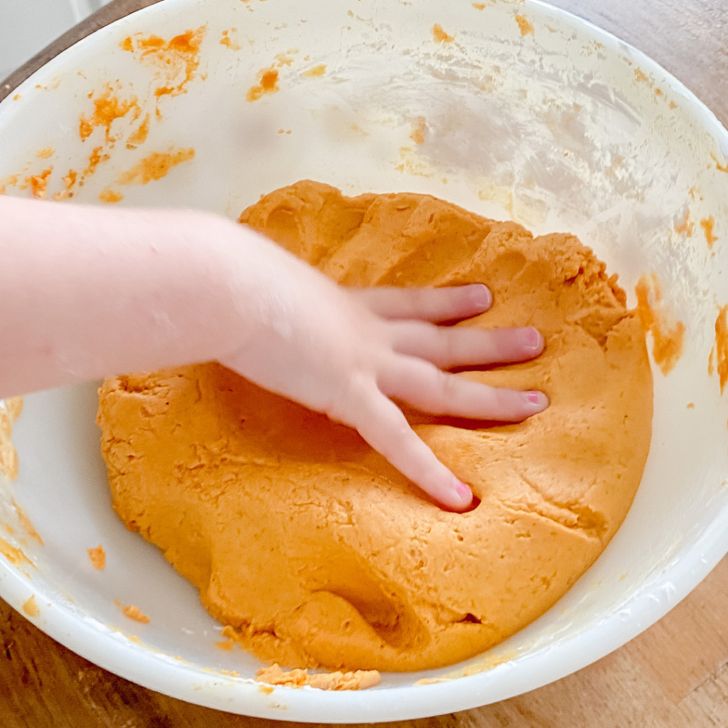Pumpkin pie play dough in bowl
